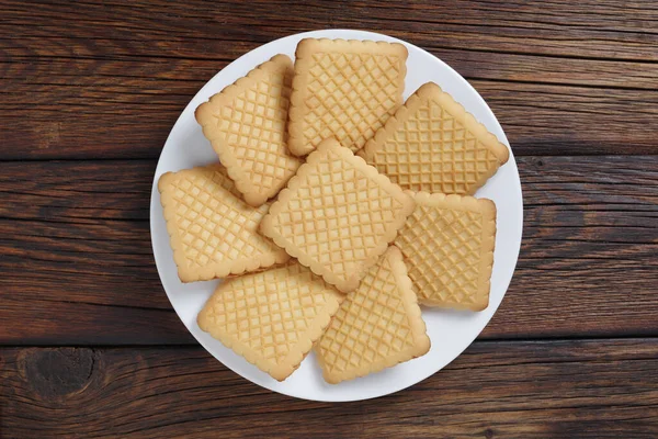 Vierkante Koekjes Een Plaat Houten Ondergrond Bovenaanzicht — Stockfoto