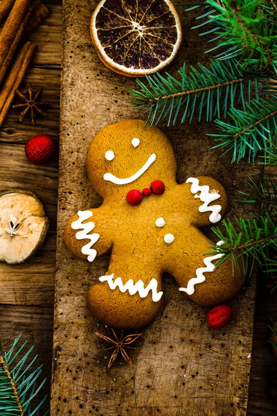 Gingerbread man on wood — Stock Photo, Image