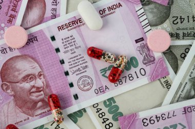 New Indian Rupee Bank Notes with Medicines / Pills clipart