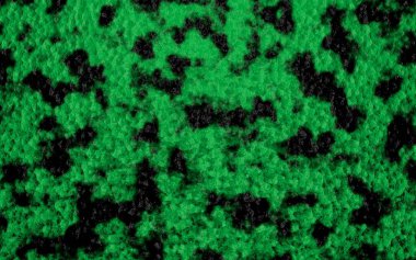 Yeşil arka plan siyah noktalar ile