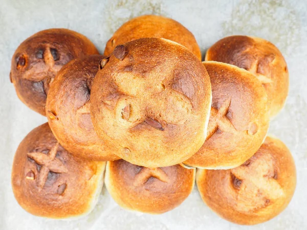 Pumkin seed buns on baking paper after baking at close-up — Stock Photo, Image