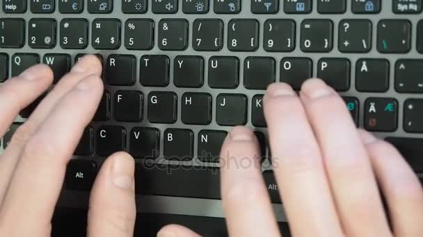 Male caucasian person typing fast on a black keyboard — Stock Video