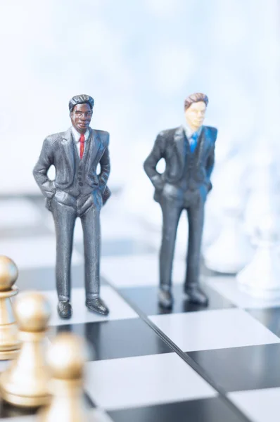 Businessmen on chessboard — Stock Photo, Image