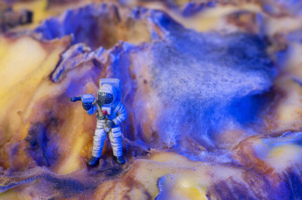Toy astronaut on an alien planet