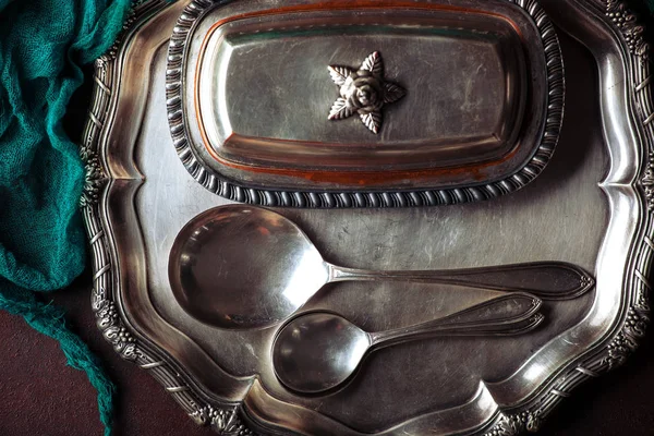 Old silver dishes with accessories for the kitchen