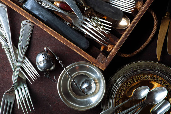 Old silver dishes with accessories for the kitchen