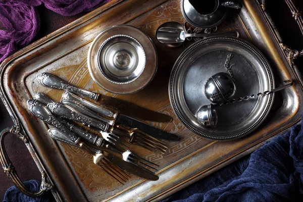 Old silver dishes with accessories for the kitchen