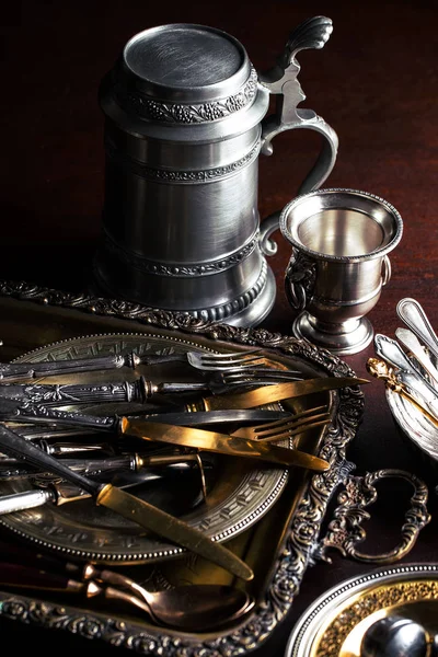 Old silver dishes with accessories for the kitchen