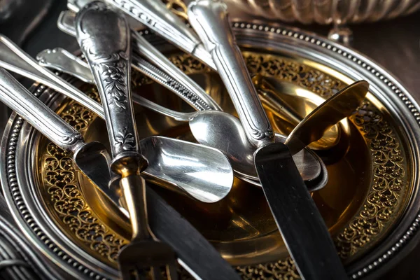 Old silver dishes with accessories for the kitchen