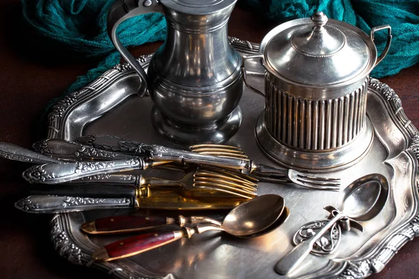 Old silver dishes with accessories for the kitchen