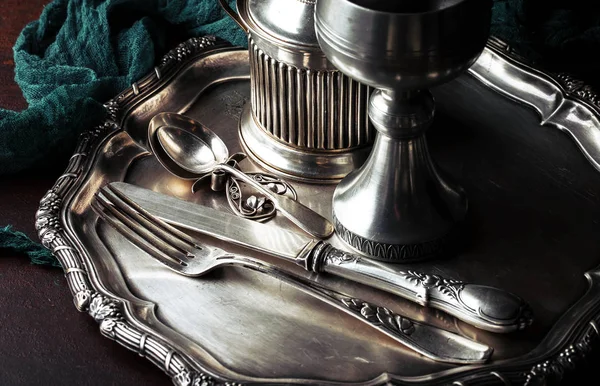 Old silver dishes with accessories for the kitchen