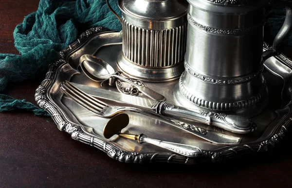 Old silver dishes with accessories for the kitchen