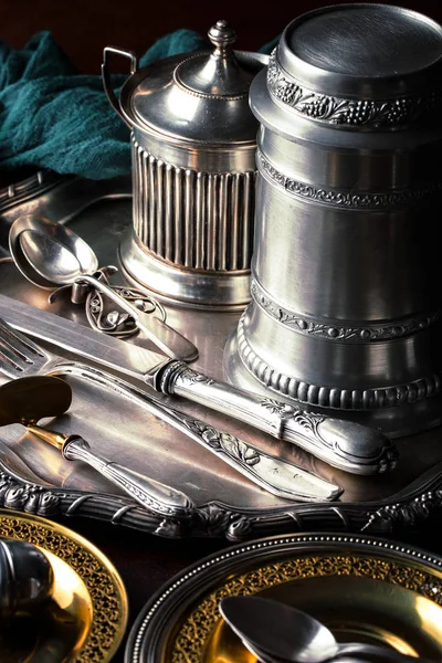 Old silver dishes with accessories for the kitchen