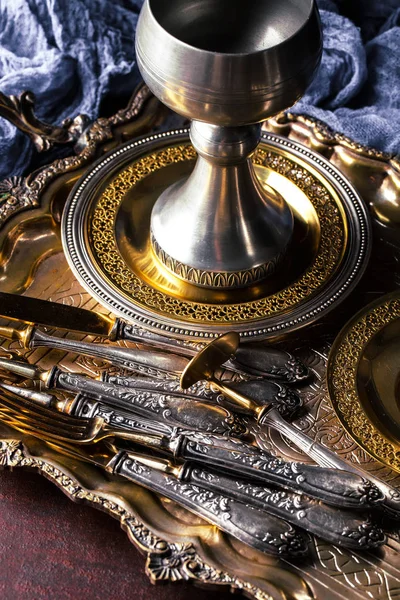 Old silver dishes with accessories for the kitchen