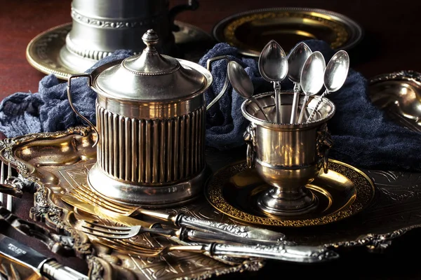 Old silver dishes with accessories for the kitchen