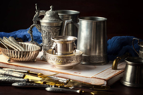 Light foam beer in a glass on an old background