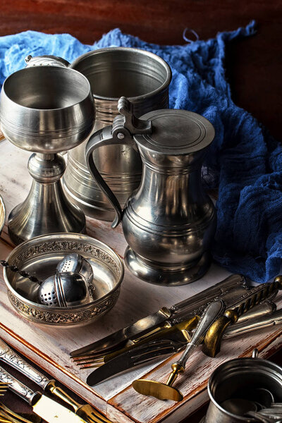 Light foam beer in a glass on an old background