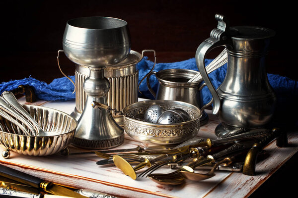 Light foam beer in a glass on an old background