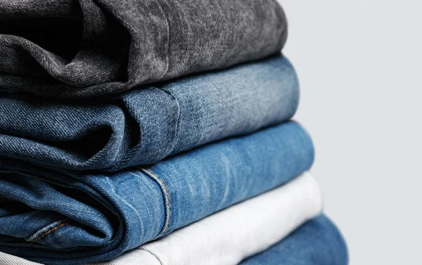 Stack of different jeans — Stock Photo, Image