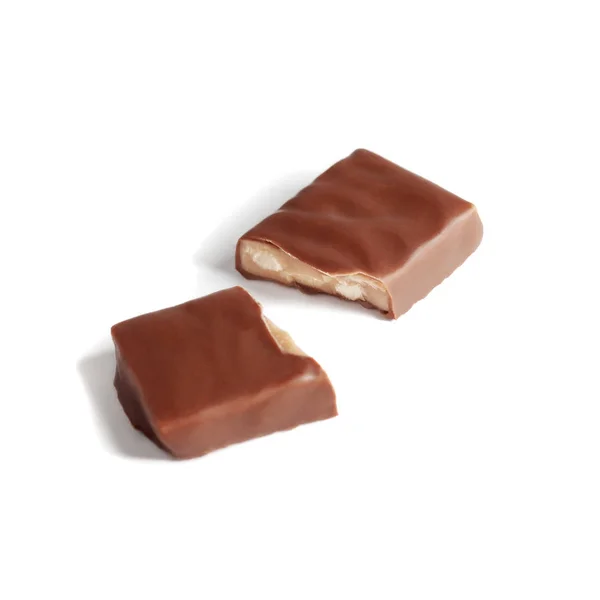Chocolate bar broken into two halves on white — ストック写真
