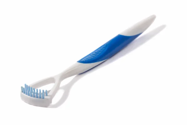 Tongue scrapers (tongue cleaner) and blue brush to eliminate bac — Stock Photo, Image