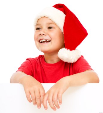Noel Baba şapkası, küçük kız Pano düzenliyor