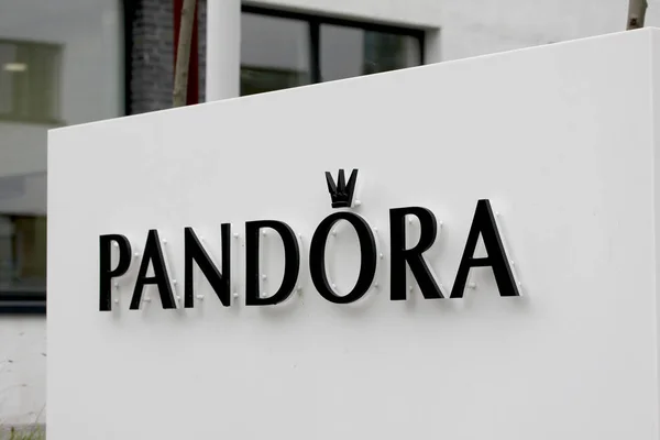 Sign panel at Pandora headquarters. Pandora is a company founded at 1982 that designs manufactures and markets jewelry — Stock Photo, Image