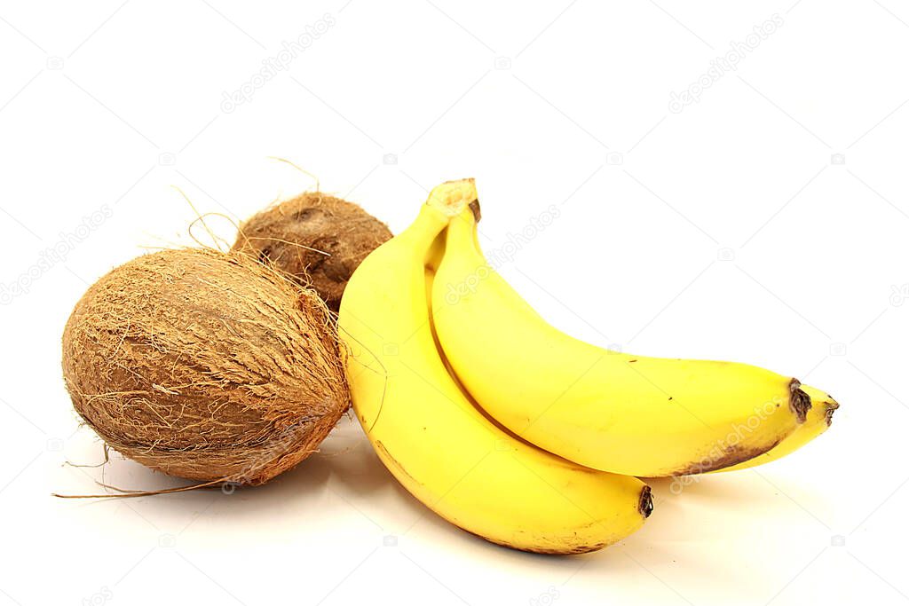 Coconuts and Ripe Bananas Closeup Isolated on White Background