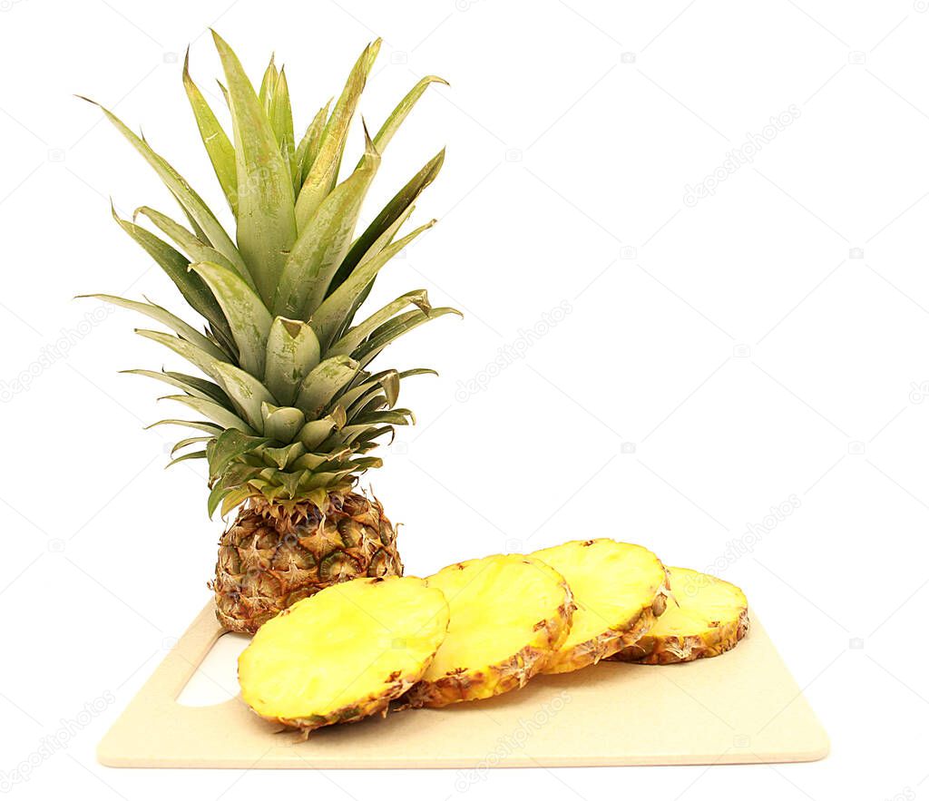 Ripe cut pineapple, pineapple slices close-up isolated on a white background
