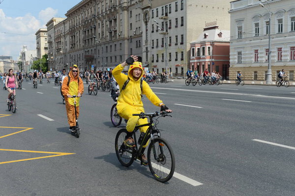   Cyclists ride on the Moscow bicycle around the Garden Ring.