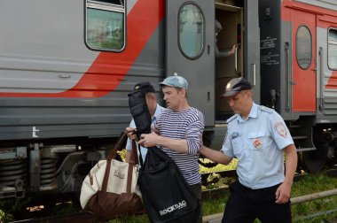  Transport police officers disembarked a passenger from the train violating public order clipart