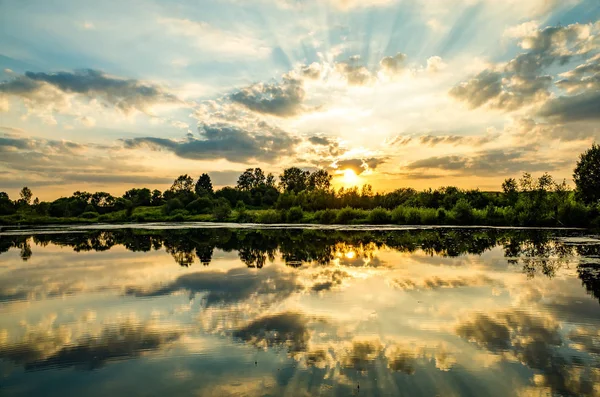 Stock image Pond, sunset in the village