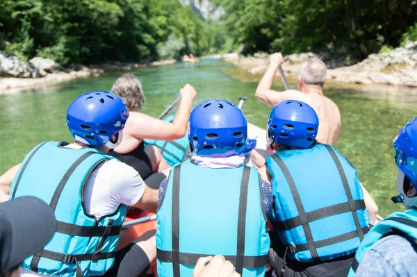 Close up of rafting team goes down the river on the beautiful su — 스톡 사진