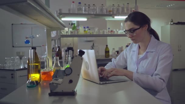 Portrait doctor working with laptop in laboratory — Stock Video