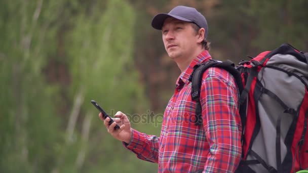 Male hiking in spring season. — Stock Video