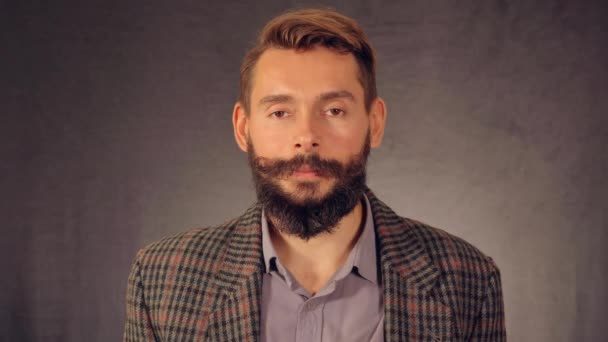 Portrait bearded hipster shows sign win — Stock Video