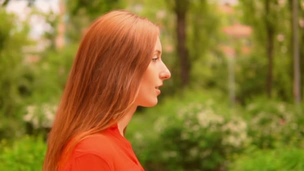 Close up profile happy woman walking in summer park — 图库视频影像