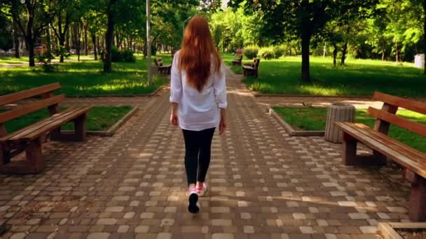 Female with red hair stroll in city — 비디오