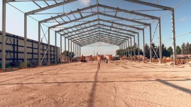 Construction of a large hangar, steel frame of the building — Stock Video