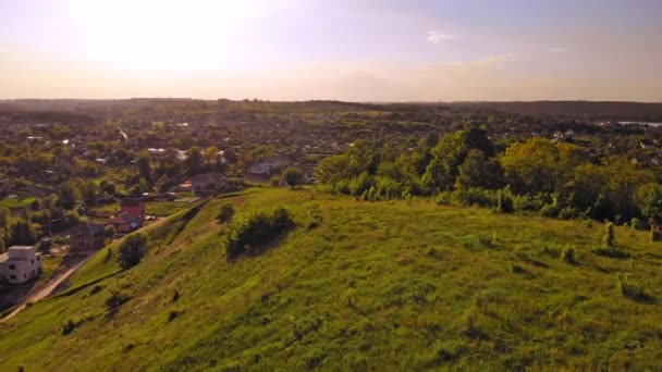 Aerial view on countryside small village and cemetery — Stock video