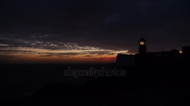 Farol em Portugal ao pôr do sol — Vídeo de Stock