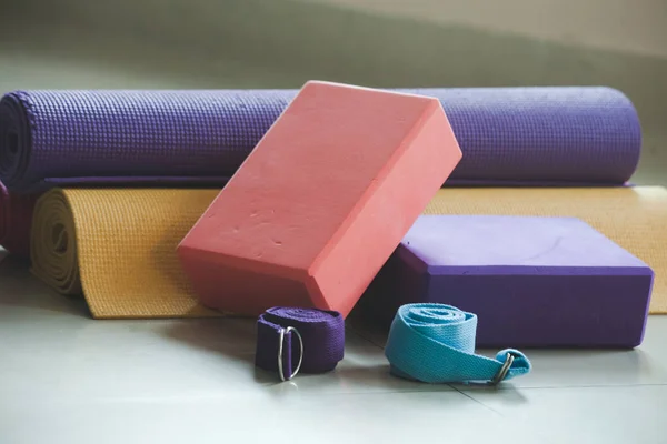 Closeup of yoga blocks belts and mat props — Stock Photo, Image