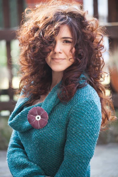 Portrait of young woman with natural curly hair — Stock Photo, Image