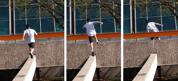 Młody człowiek robi skok parkour w mieście — Zdjęcie stockowe