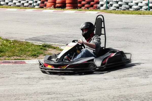 Man drive go kart on track back view — Stock Photo, Image