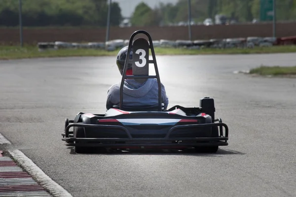 Man drive go kart on track back view — Stock Photo, Image