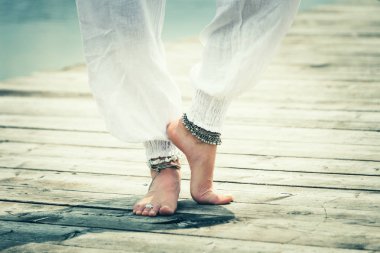 closeup of barefoot woman feet practice yoga outdoor  clipart
