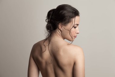 natural beauty concept young woman with wet hair in bun profile 