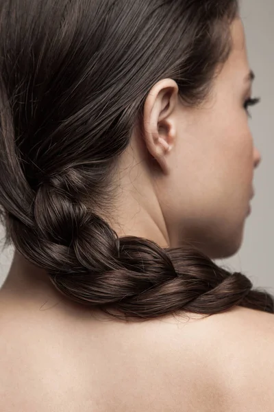 Closeup of wet woman hair in braid studio shot rear view focus o — Stock Photo, Image