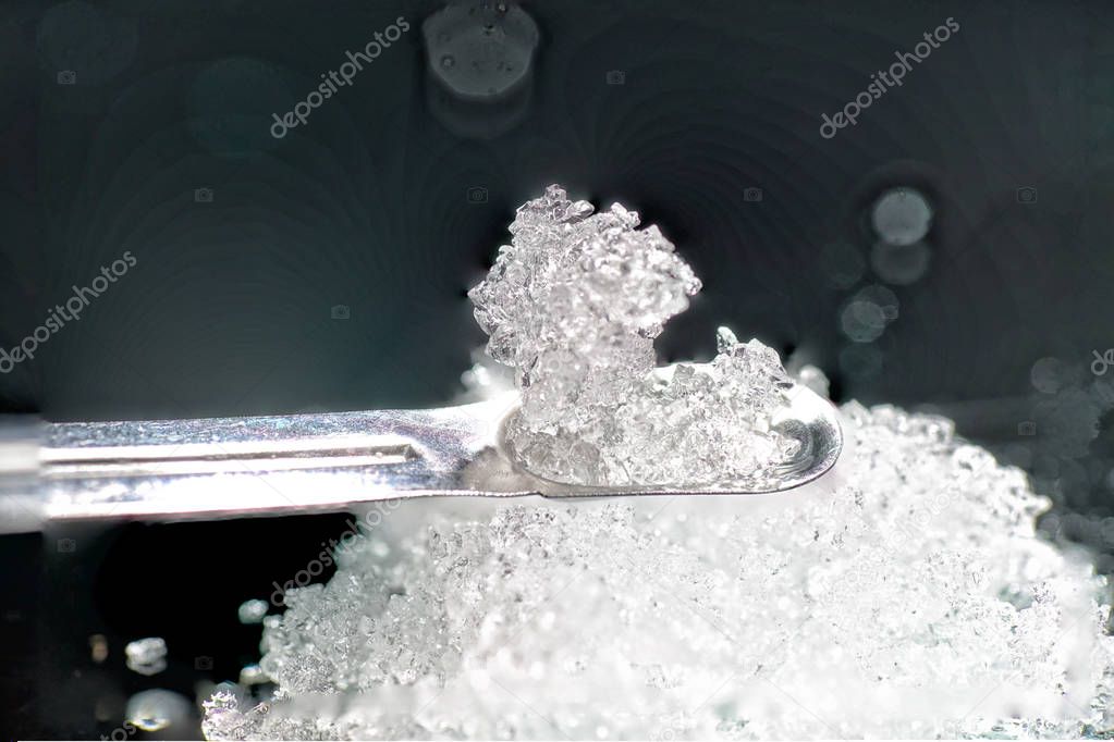               Chemical powder from the chemistry kit with macro lens photographed in studio                 